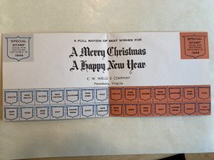 This wartime Christmas card reflected the ubiquitous ration books at home. Inside, the sender hoped for more abundance of rationed items like peace and happiness.