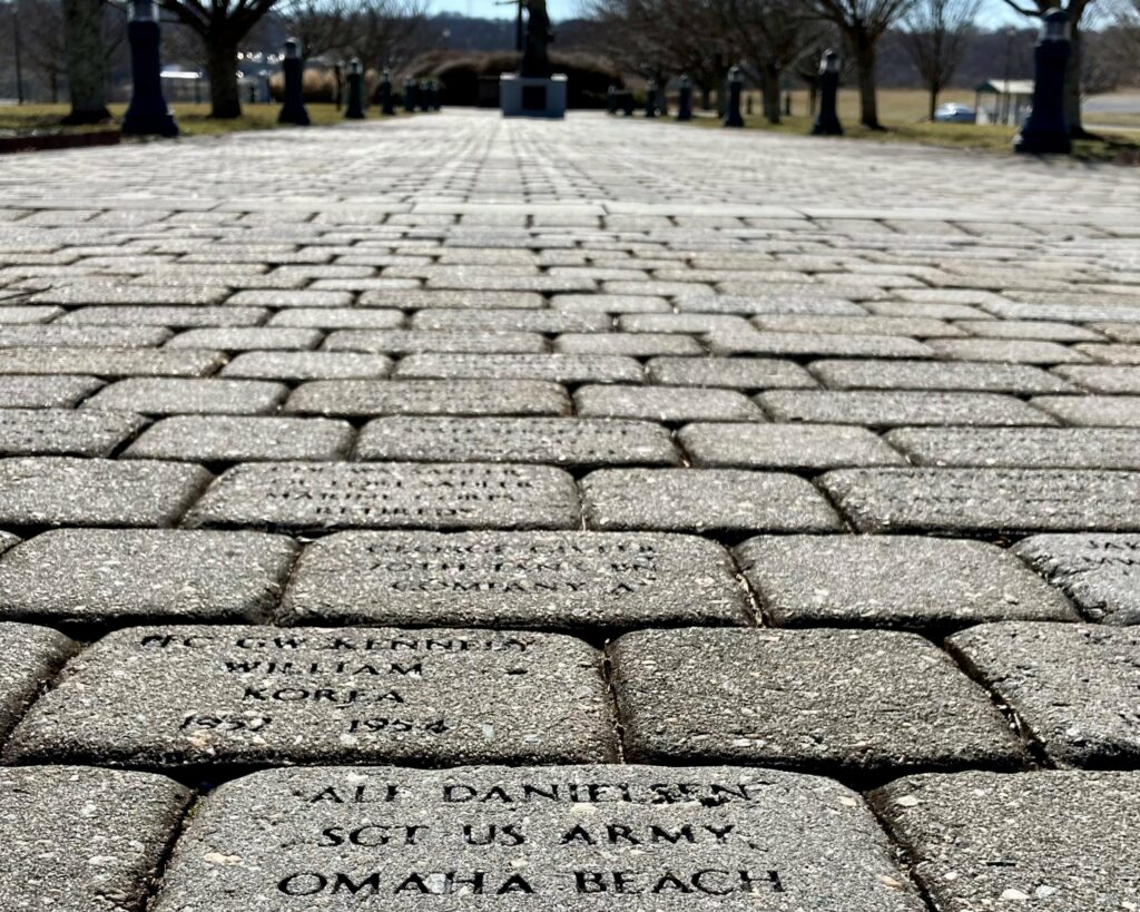 Close-up view of the Annie J Bronson Brick Walk depicting bricks engraved with names and dates